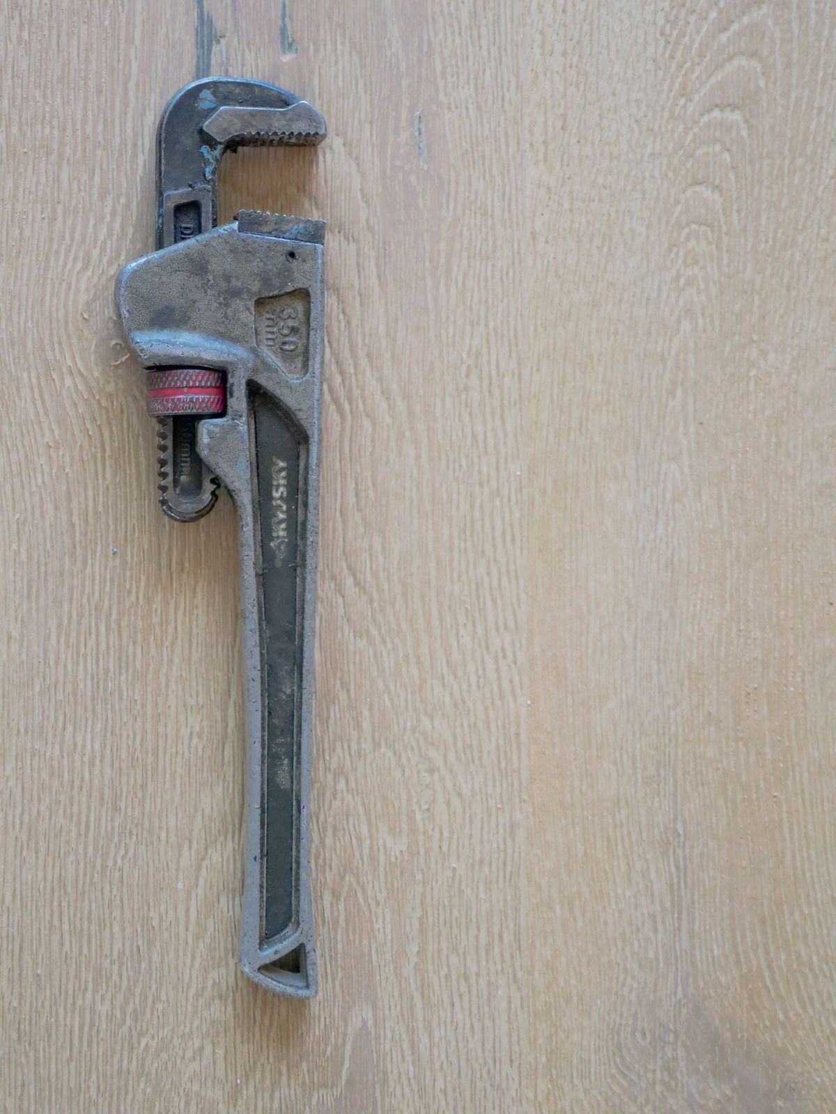 Pipe wrench on a workbench